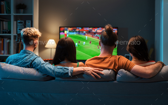 Couples watching soccer together - Stock Photo - Images