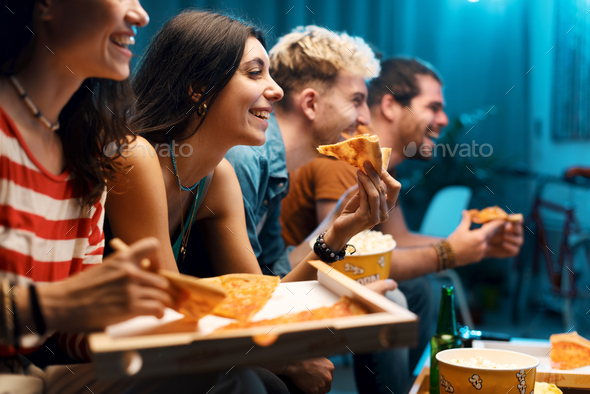 Happy friends watching movies together - Stock Photo - Images