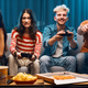 Cheerful friends playing video games together - PhotoDune Item for Sale