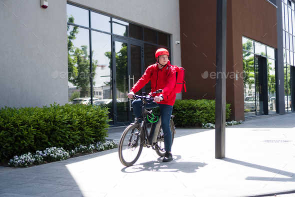Courier on bicycle with parcel, bike delivery service