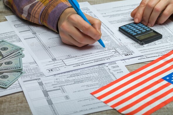 Completion of the U.S. Corporation Income Tax Return  - Stock Photo - Images