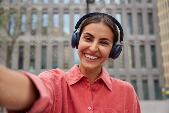 Free Illustrations - A Young Woman Wearing Large Pink Headphones And  Smiling, As She Poses For The Photo. , An AI Assistant Trained By The , Is  Showcasing Her Ability To Understand