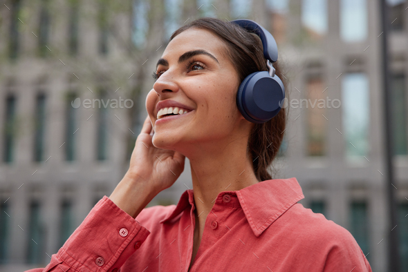 Free Photos - A Woman Sitting At A Table, Wearing Headphones And Enjoying A  Cup Of Coffee. She Appears To Be Relaxed And Immersed In Her Music As She  Poses For The