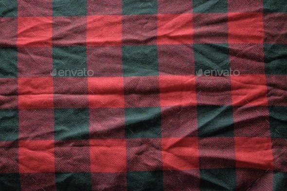 Closeup shot of a red and black flannel perfect for a holiday background