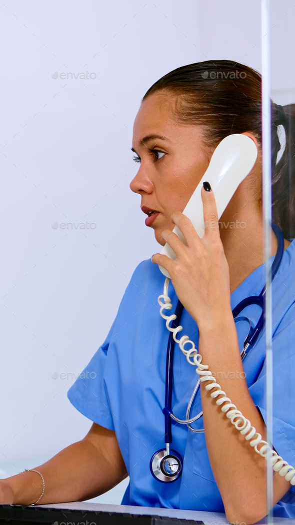 Specialist healthcare physician talking at phone in medicine clinic