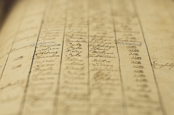 Soft focus of an old book of local records with list of residents\' names and information