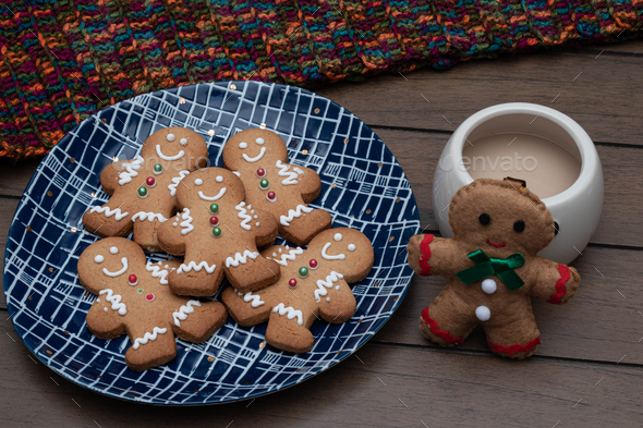 Christmas gingerbread man cookies on a blue plate - Stock Photo - Images