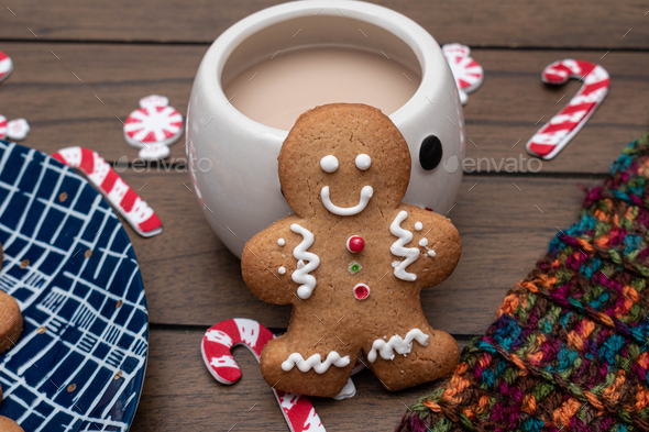 Gingerbread man cookie in a hot tea mug - Stock Photo - Images