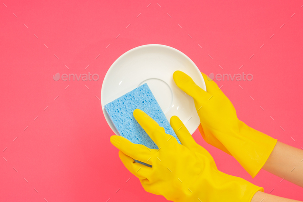 Dishwashing concept, Hands in rubber gloves to holding light blue sponge and wash the dishes
