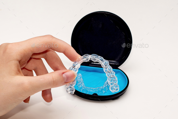 Transparent aligners and storage case box. Invisible braces. Clear teeth straighteners.