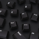 Black computer keys scattered on a black background - PhotoDune Item for Sale