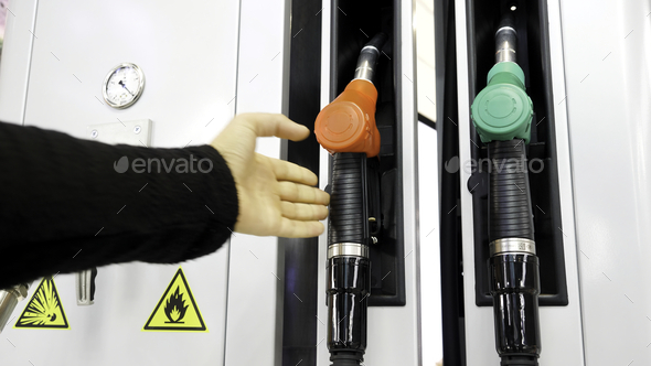 Gas station. Media.Cylinders with gasoline and gas are taken and then put in place for refueling the