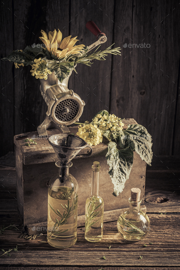 Imaginary and antique virgin oil machine with seeds and sunflower.