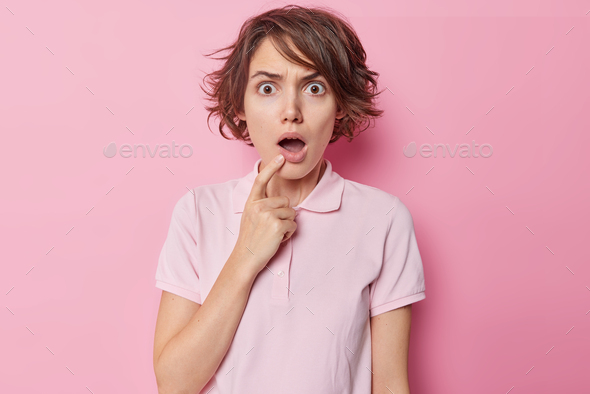 Waist Up Shot Of Shocked Embarrassed Short Haired Woman Keeps Mouth