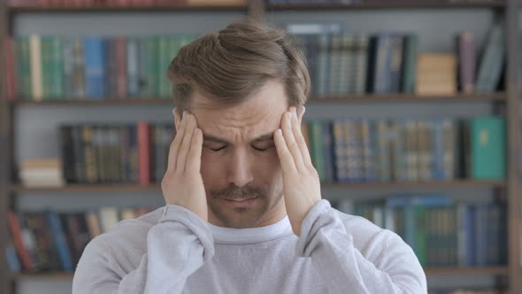 Headache, Portrait of Tense Middle Aged Man in Office alt