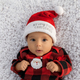 Portrait of infant baby girl dressed in Christmas outfiit looking at camera - PhotoDune Item for Sale