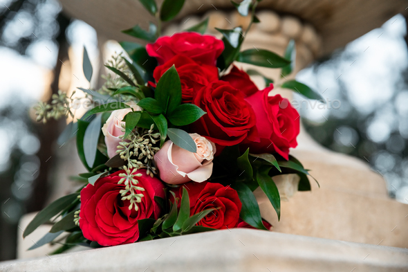 Bridal flowers on Wedding Day, bouquet of red roses  - Stock Photo - Images