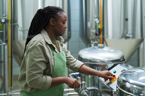 Brewery Worker Setting Equipment - Stock Photo - Images