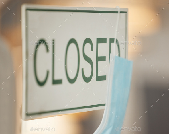Covid face mask, closed and door signage on cafe, restaurant or coffee shop glass window in pandemi