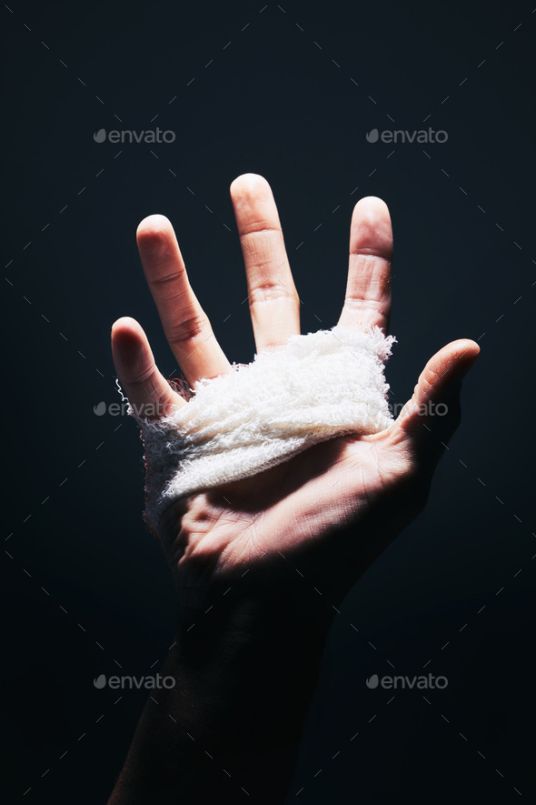 Bandage, black and hand palm of man with medical injury pain, first aid care and hurt from mma figh