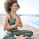 Yoga, zen and wellness, black woman at the beach for fitness and  meditation, mindfulness and peace Stock Photo by YuriArcursPeopleimages