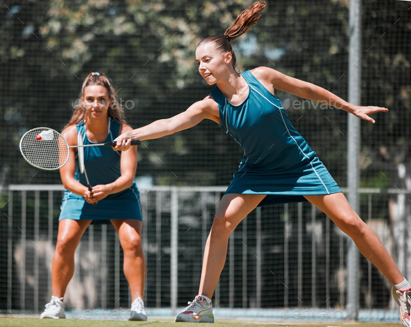 Sports women, fitness or badminton for teamwork, sport wellness or training game on tennis court in