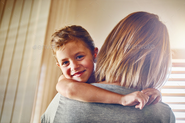 Mom means the world to her. Portrait of a little girl bonding with her mother at home. - Stock Photo - Images