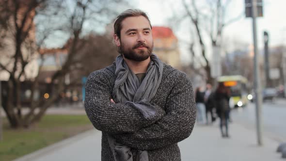 A Happy Bearded Man is Walking Around the City alt