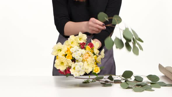 Florist Makes a Bouquet for Celebration, White, Close Up alt