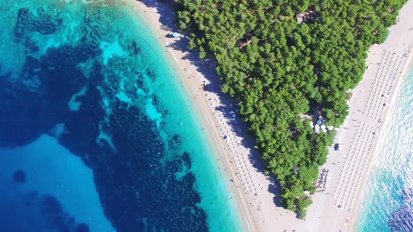 Flying over of the sandy beach Zlatni rat on the island of Brac, Croatia alt