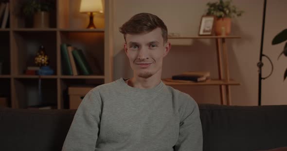 Crop View of Millennail Cute Man Turning Head and Looking to Camera alt