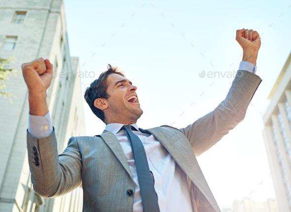 Im simply the best. Shot of a businessman celebrating a success in an urban setting.