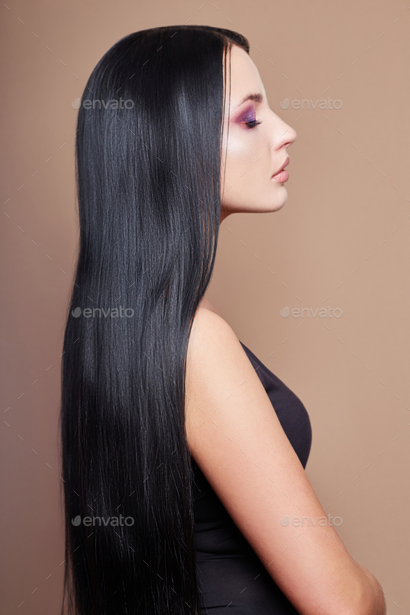 Perfect straight long hair woman, lamination and straightening hair. Strong black hair
