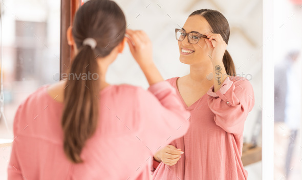 Woman, glasses and mirror at optometrist, new frame and lense for vision, eye and eyesight after sh