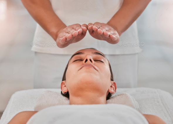 Relax, health and reiki with woman on spa table for healing energy, zen and alternative medicine. P
