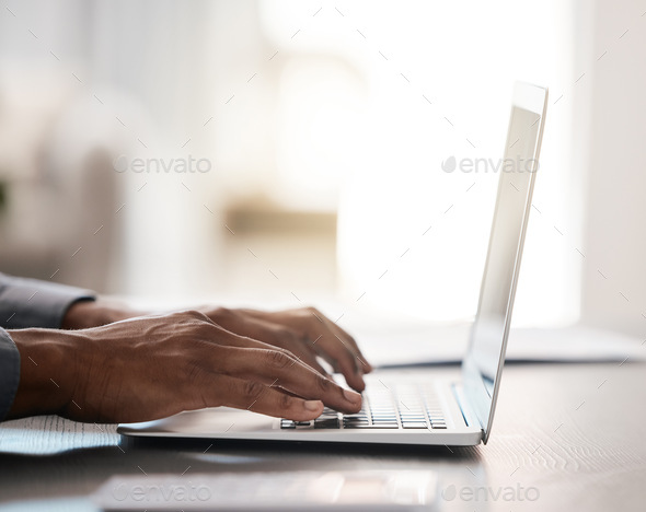 Closeup, hands and typing on laptop with black man at desk for email, communication or digital mark