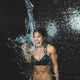 Woman Taking a Cold Shower from Ice Bucket. - PhotoDune Item for Sale