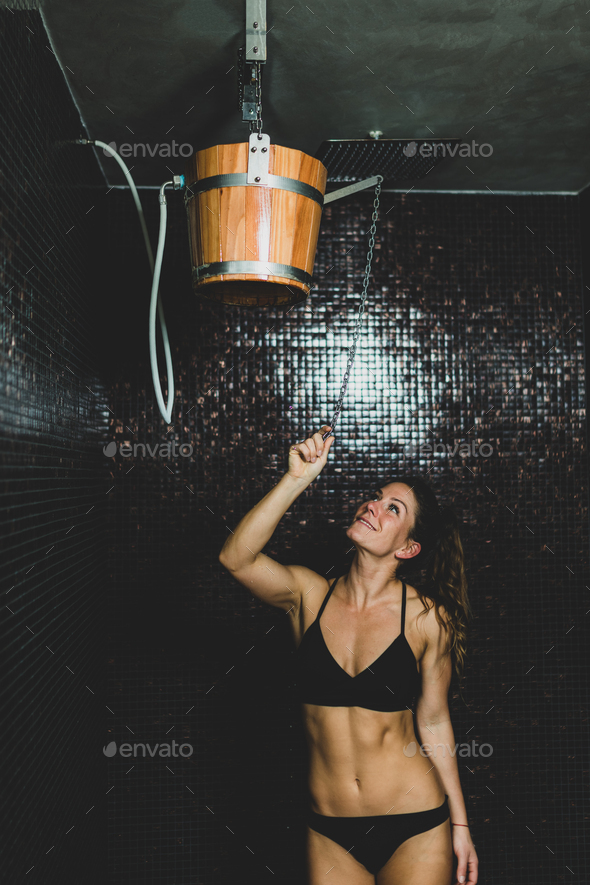 Beautiful Woman Under the Ice Cold Shower Bucket - Stock Photo - Images