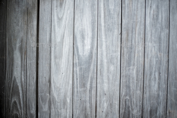 Closeup shot of a wall made of vertical gray wooden planks - perfect for cool wallpaper background