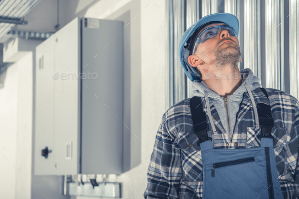 HVAC Technician Checking Air Ducts During Scheduled Maintenance - Stock Photo - Images