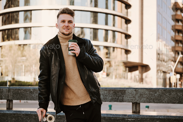 Portrait of a skater drinking take away coffee outdoors