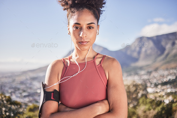 Fitness, exercise and black woman outdoor listening to music with earphones for motivation, energy