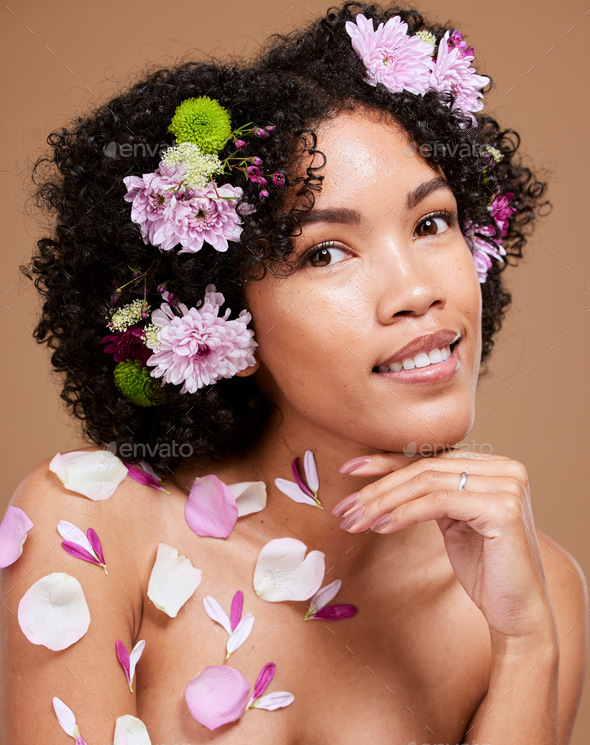 Beauty, art and black woman with flowers in hair in portrait with