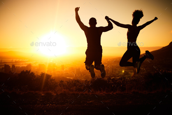 Sunset silhouette, couple jumping and nature hike adventure for fun fitness exercise, wildlife holi