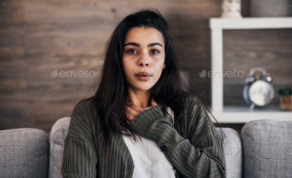 Anxiety, worry and woman breathing on sofa to relax, calm down and stress relief from panic attack.