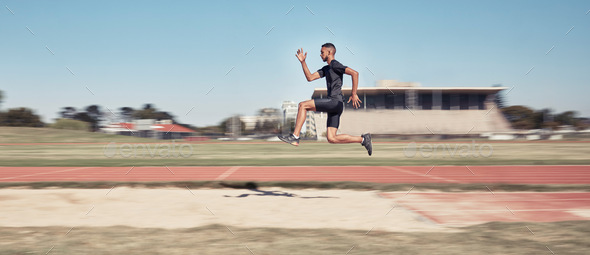 Runner, man jump and sports stadium for marathon training, fitness workout or wellness exercise on