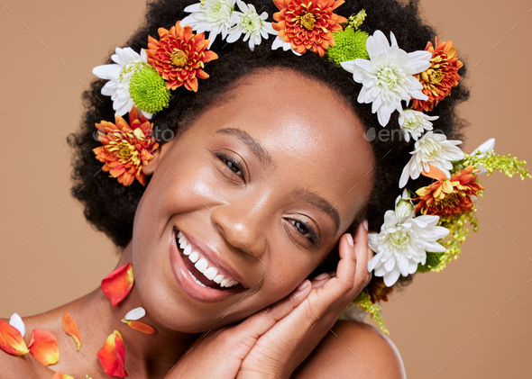 Beauty, art and black woman with flower crown in hair and smile on face, portrait with studio backg