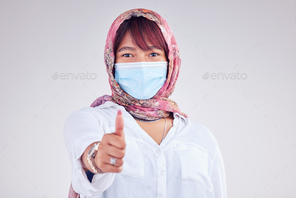 Covid face mask, muslim woman and thumbs up, portrait and vaccine yes vote, safety compliance and e