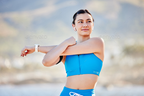 Fitness, exercise and woman stretching outdoor and listening to music in nature for energy and card