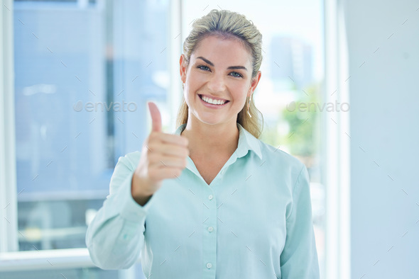 Woman, thumbs up or success in modern office, real estate company or property development startup a